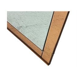 Frameless art deco mirror, scalloped copper tinted border central fan motif, bevelled edges with decorative screw caps
