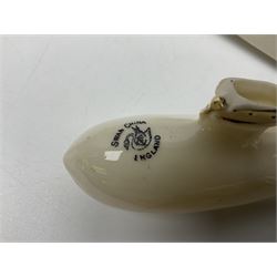 Ten WW1 crested china military models comprising submarine, four ships including Lusitania, four Zeppelins/balloons and an aircraft; various makers including Arcadian China, Swan China, Carlton China, Waterfall, Grafton China etc; various crests including Saint Neots, Great Yarmouth, Tewksbury, Swanage, Simons Town, Hull etc (10)