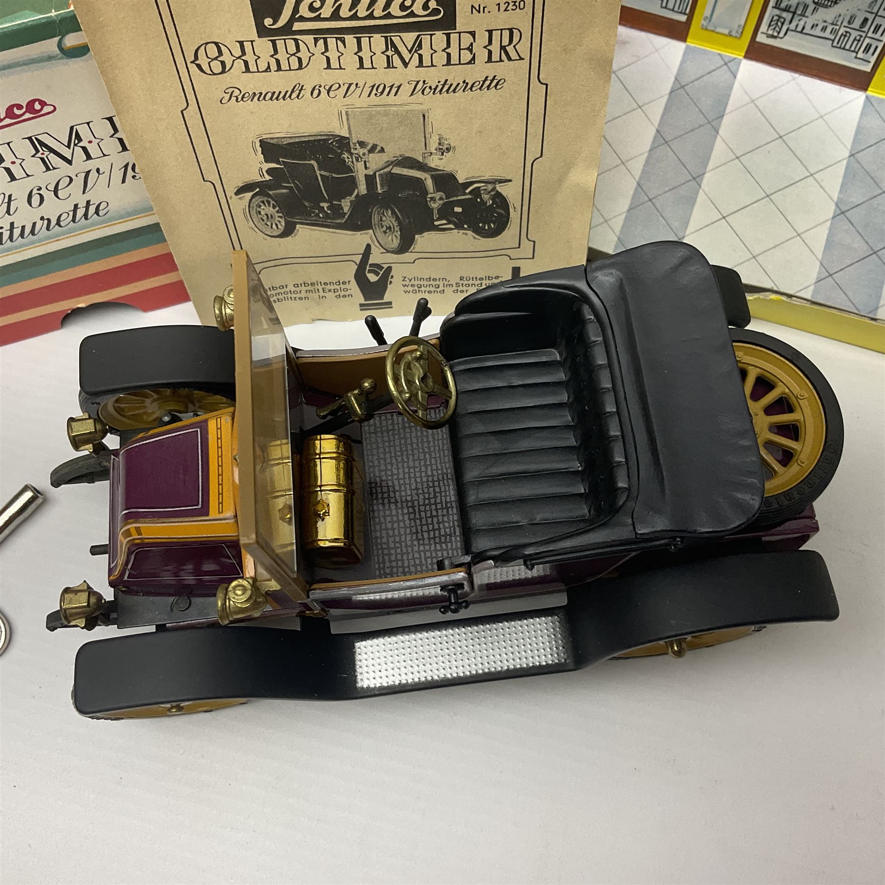Schuco - four boxed Old Timer series tin-plate model cars comprising two 1228 Opel Doktor-Wagen 1909, one in yellow and another in blue, 1229 Mercedes Simplex anno 1902, and 1230 Renault 6CV/1911 Voiturette 