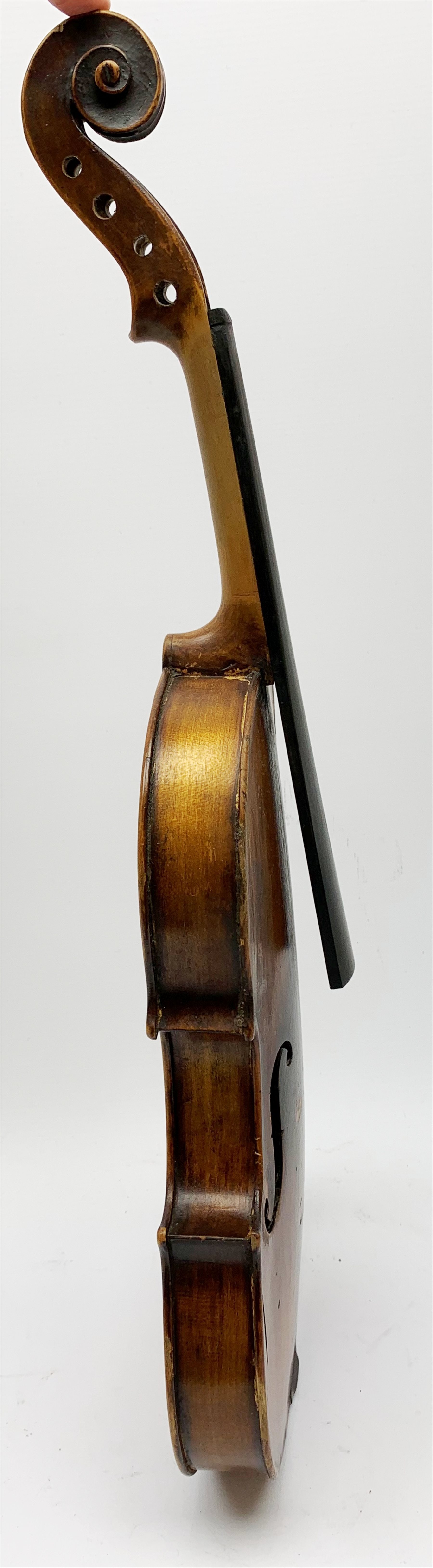  Late 19th century German violin for completion with 36cm one-piece maple back and ribs and spruce top, bears label Copie De Albani Palermo 1633, 59cm overall together with three books on violin construction, restoration and varnishing  