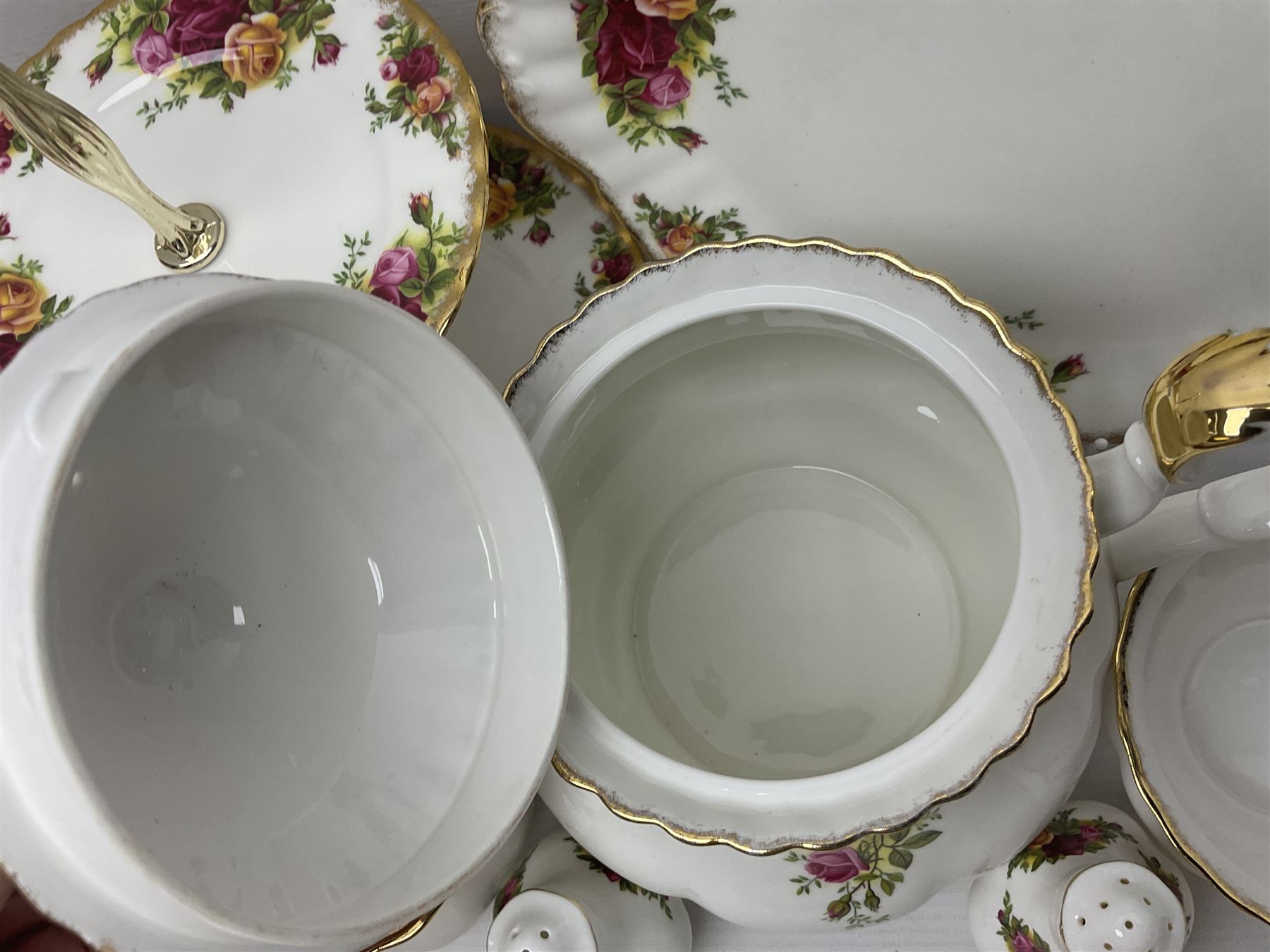 Royal Albert Old Country Roses pattern tea service for six, comprising teapot, sucrier, milk jug, dessert plates, one cake plate, one two tiered cake stand, salt and pepper pots and bud vase 