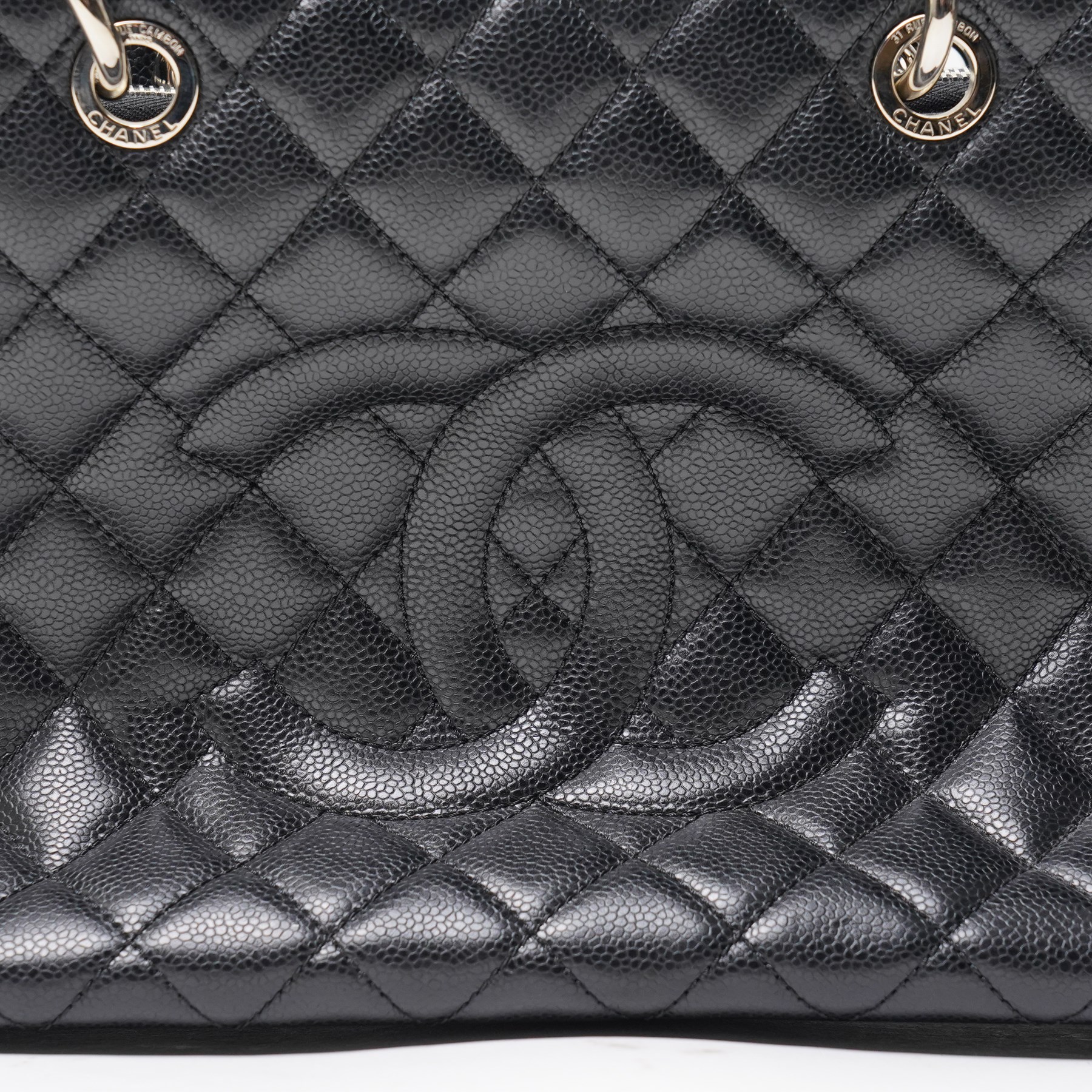 Chanel - black GST Grand Shopping Tote, caviar leather with classic diamond quilting and large embroidered CC logo to the centre front, with polished silver-tone hardware, a rear patch pocket, chain and leather handles, and an open top with three main interior compartments, 2009-2010, serial number 13547470