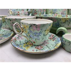 Shelley Melody pattern tea service for six, to include teapot, teapot stand, hot water jug, milk jug, covered sucrier, teacups and saucers, cake plates etc (31)