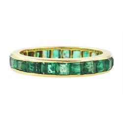 18ct gold emerald full eternity ring, channel set with calibre cut emeralds