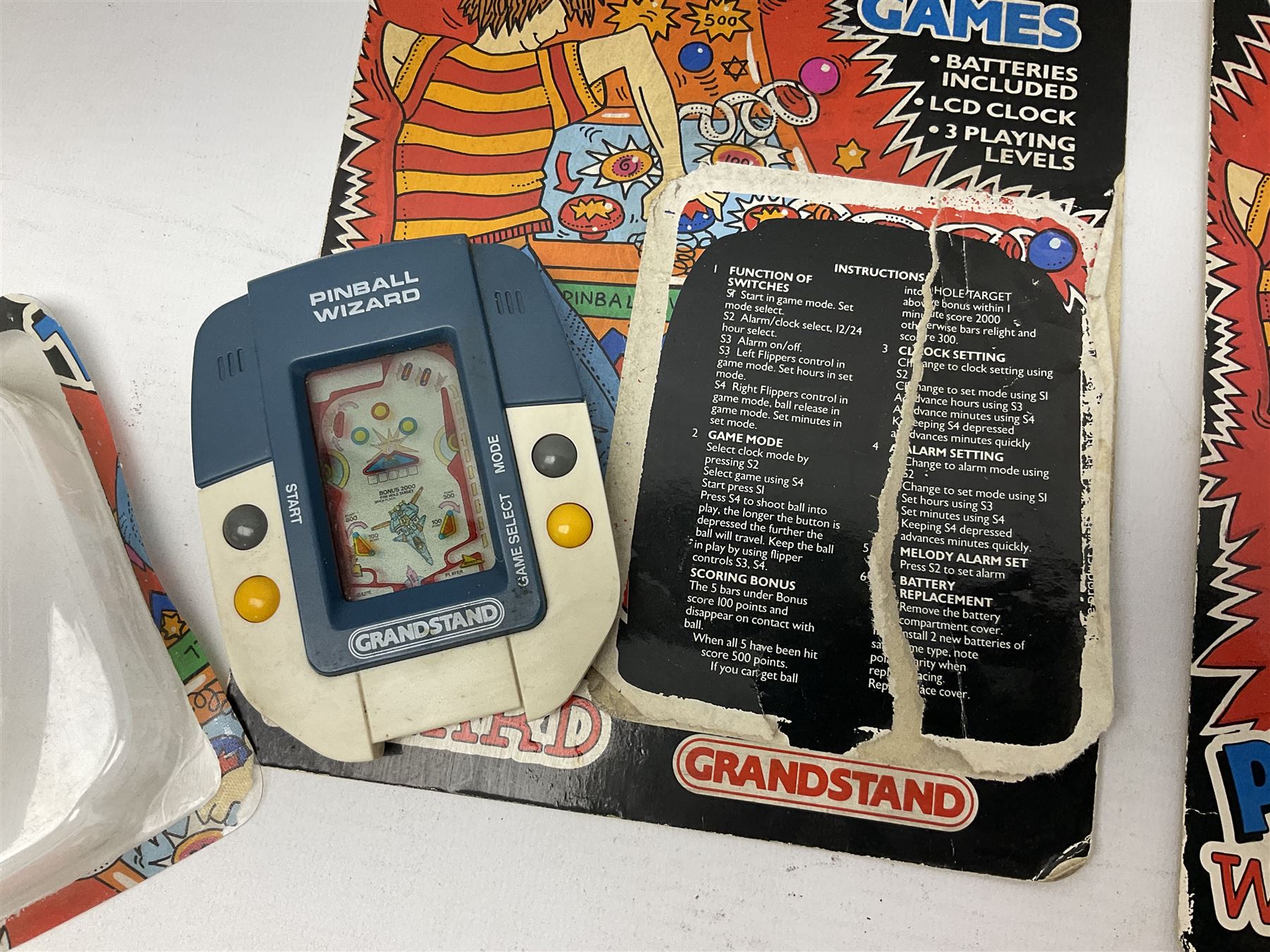Collection of retro handheld games, including Nintendo Game & Watch ‘Snoopy Tennis’ (1982) and ‘Squish’ (1986) both with instruction booklets, Casio CG-600 ‘Star Invader’ with box, 3 in 1 LCD cartridge game including ‘Soccer’, ‘Invader’ and ‘Bomb Finder’ games, and two Grandstand ‘Pinball Wizard’ (1988) games, both with original boxes