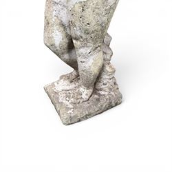 Early composition stone figure of a boy with grape basket, original flakey white paint