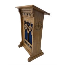 20th century ecclesiastical oak lectern, the sloped rest on moulded end supports with carved decoration, the front panelled with Gothic style carved and pierced tracery, on sledge feet