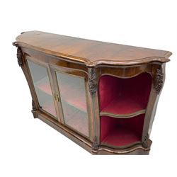 19th century rosewood buffet credenza, bombe form with shaped and moulded top, two central glazed doors with foliate moulded gilt slips, the red fabric-lined interior fitted with a single shelf, flanked by open shelves with raised gilt metal lips, the uprights decorated with shell and flower head carved cartouche mounts, acanthus leaf scroll carved lower mounts, on shaped and moulded plinth base 