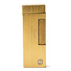 Dunhill - Rollagas lighter, gilt metal with vertical reeded decoration and ribbed thumbpie...