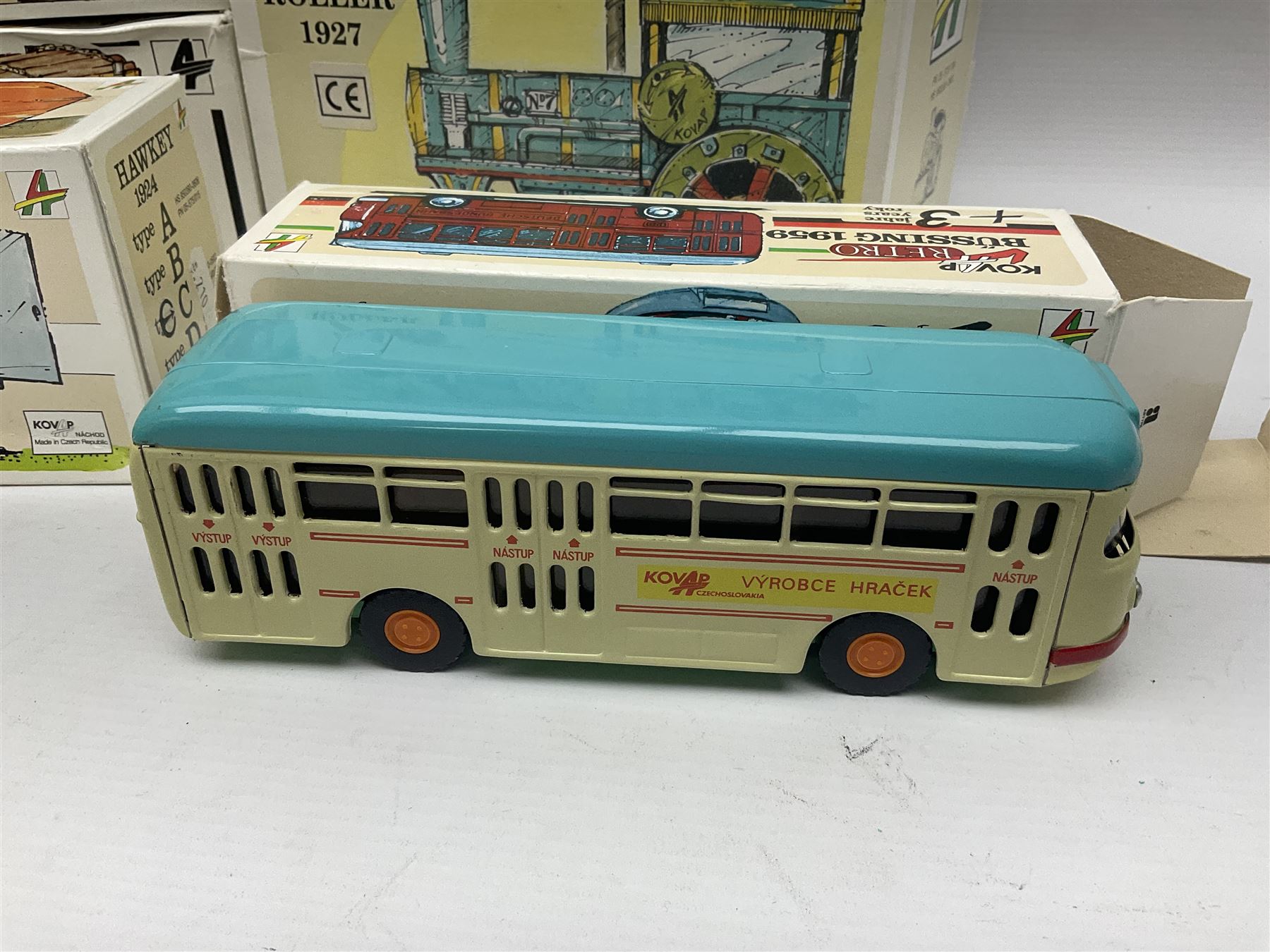 Kovap - eleven tinplate models to include Tractor and Trailer, Road Roller 1927, Moving Moneybox 1924, Hawkeye type B 1924, Boy on a Tricycle; all in original boxes 