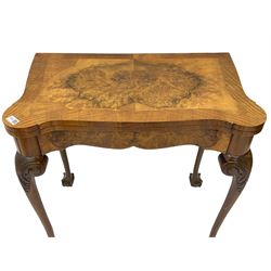 20th century figured walnut card table, shaped fold-over and cross-banded top, baize lined interior, on acanthus carved cabriole supports 
