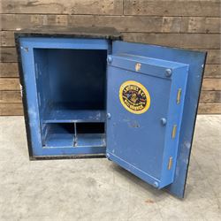 Samuel Withers & Co of West Bromwich - Victorian cast iron safe, the brass handle modelled as a clenched fist, painted in red, orange and black, with key. Ground floor delivery only, no steps.