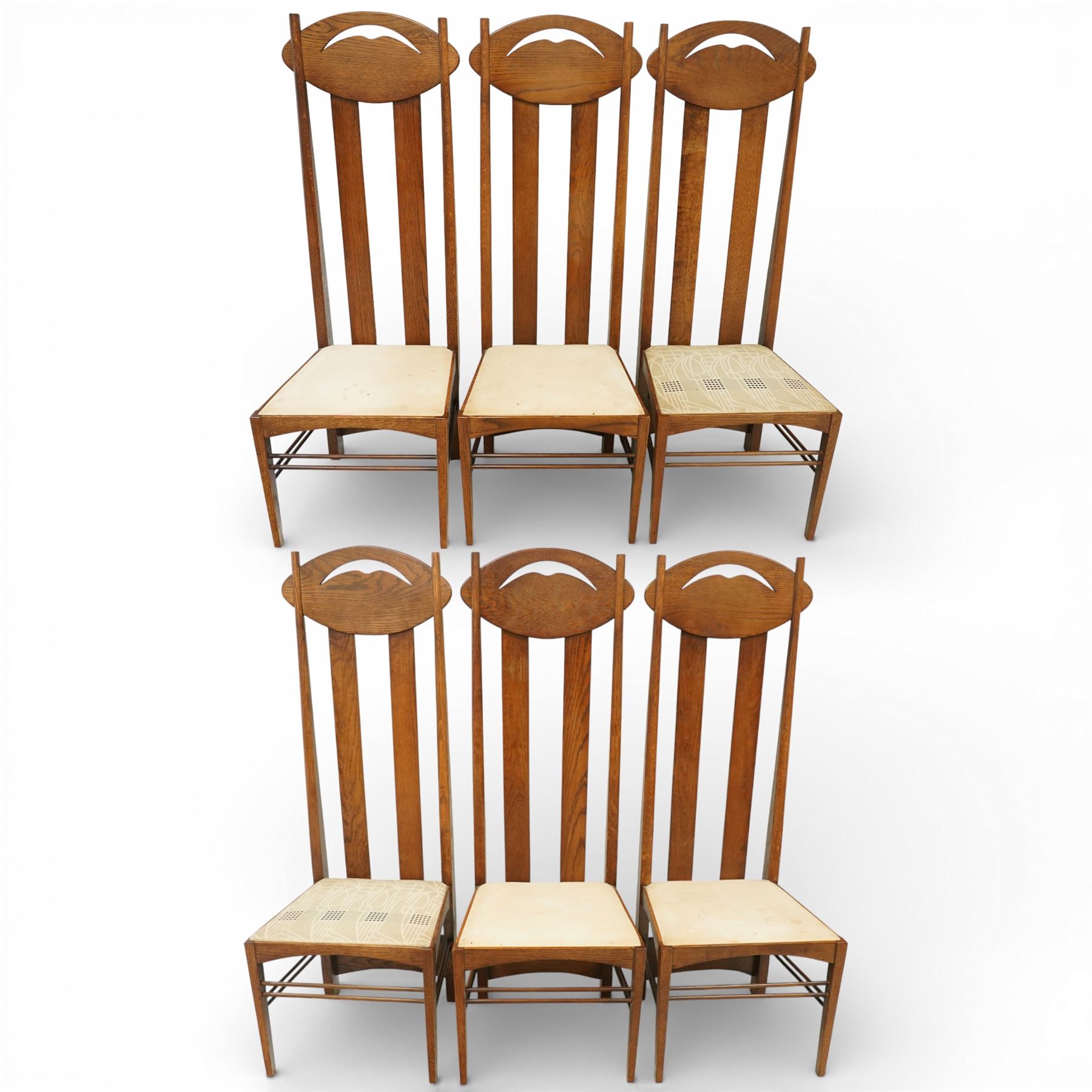 Late 20th century Mackintosh design oak 'Argyle' dining chairs, with elongated backs featuring pierced shaped top rails and twin vertical splats, upholstered seats, raised on square legs with stretchers