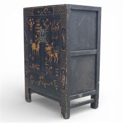 19th century Chinese black lacquer marriage cabinet, rectangular form, twin cupboard doors painted with gilt chinoiserie scenes depicting mounted figures, ritual urns and symbolic objects within patterned borders, central shaped metal lock plate with twin drop handles, lower section decorated with fruiting sprays, standing on stile supports