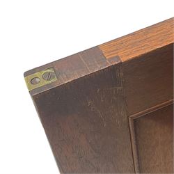 Early 19th century figured mahogany bureau bookcase, projecting splay moulded cornice over three adjustable shelves enclosed by two glazed doors, fall front revealing pigeonholes, cupboard and drawers, pull-out strays with scroll carved terminals, double cupboard with two panelled doors, on turned feet 