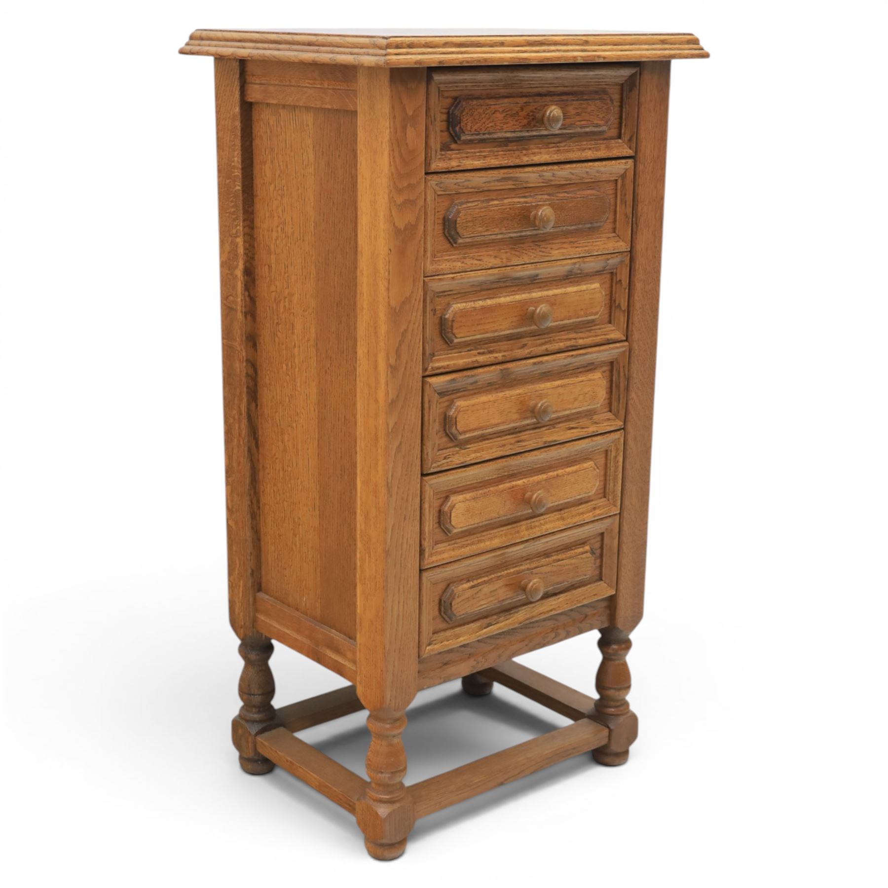 Early 20th century oak pedestal chest, with six drawers with moulded edges, raised on turned supports united by a stretcher 
