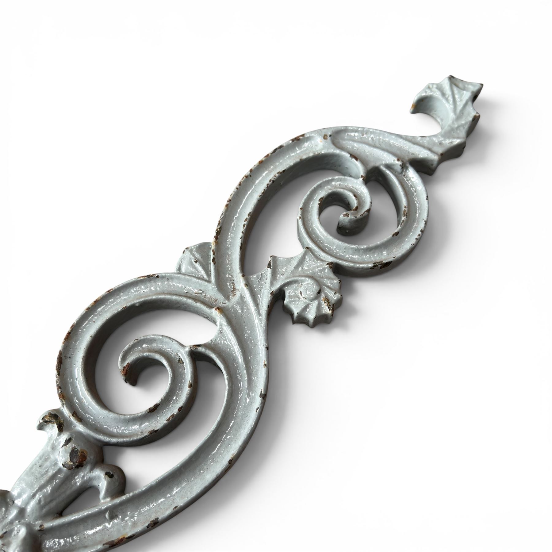 Set of eleven 19th century cast iron ornate stair or banister spindle supports, of scrolling form with scalloped decoration and flower-head motifs, in weathered duck-egg blue painted finish (11)