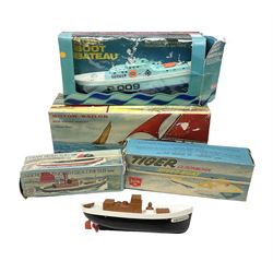 Five model boats - Sutcliffe clockwork Tiger Speedboat; boxed; Motor Sailor battery operated yacht; boxed; Waterline battery operated police launch; boxed; and Tri-ang Scalex 'Aberdeen' North Sea Drifter; boxed, with another similar unboxed (5)