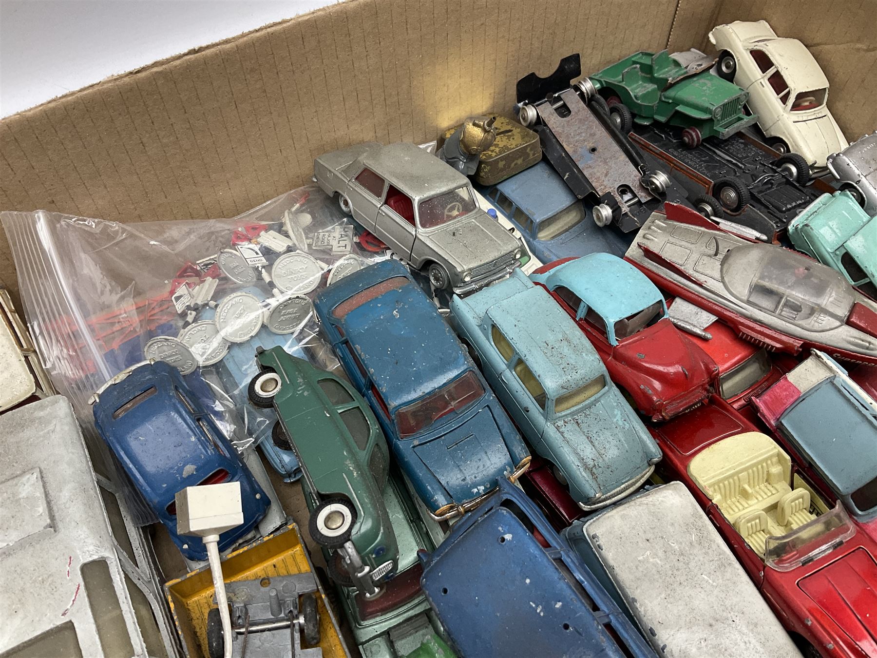 Dinky - over thirty unboxed and playworn die-cast models including Vega Major Luxury Coach, Peugeot 404, Humber Hawk, Ford Transit Van, Jaguar Type D etc; fourteen Dinky road signs; and quantity of other models including Budgie Supercar, Tri-ang Spot-On, Tekno etc