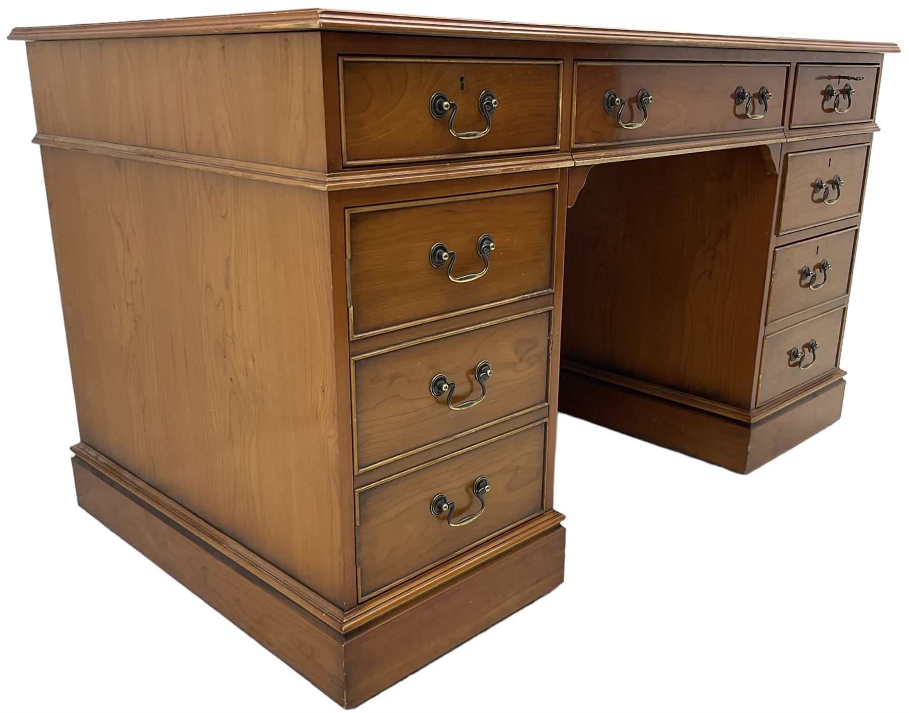 Cherrywood twin pedestal desk, rectangular leather inset top over central fall front with keyboard slide and two drawers, fitted with two drawers and cupboard, on bracket feet