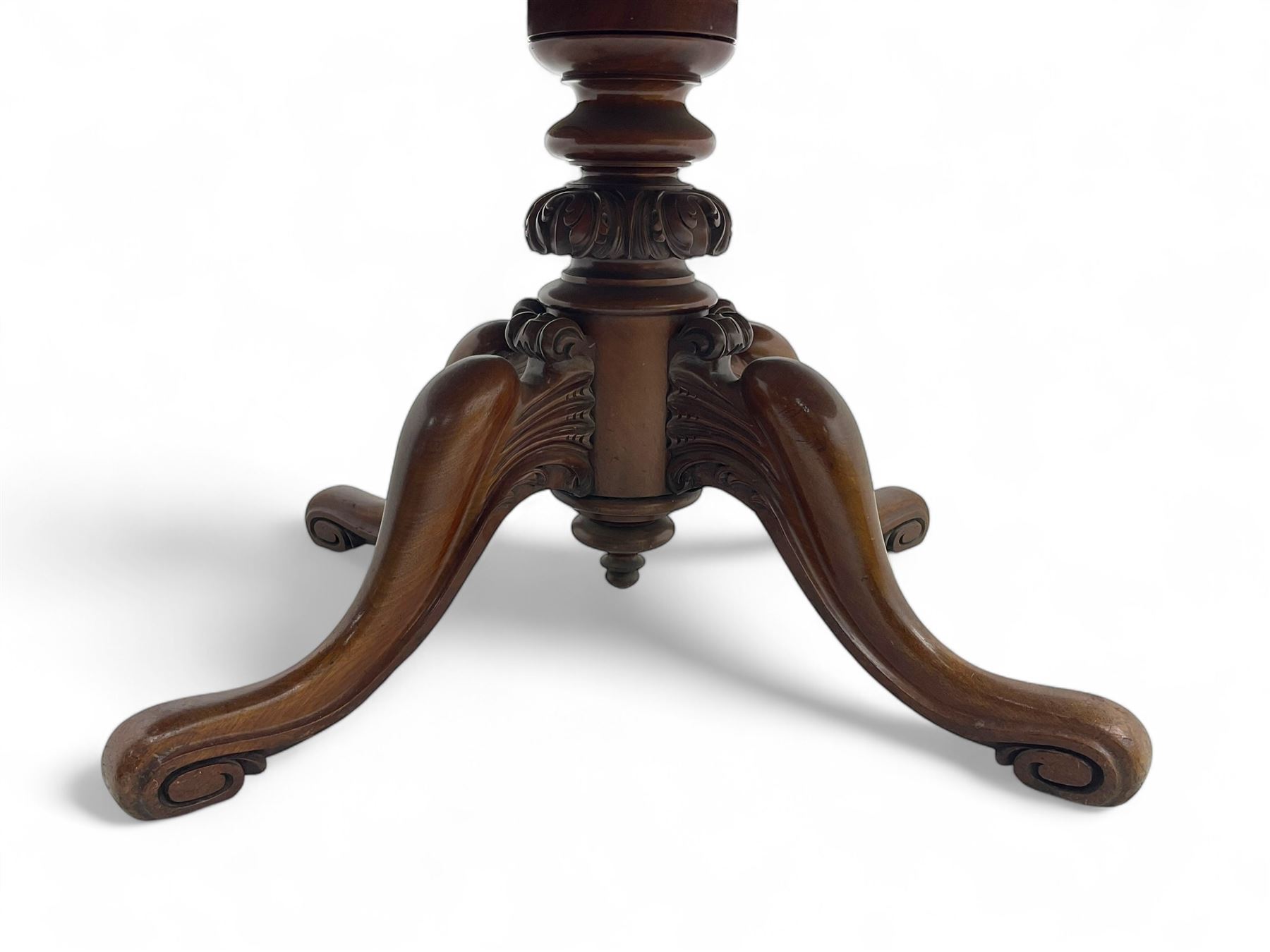 Victorian mahogany breakfast loo table, oval tilt-top on turned pedestal, quatrefoil out-splayed carved supports, scroll carved terminals with brass castors