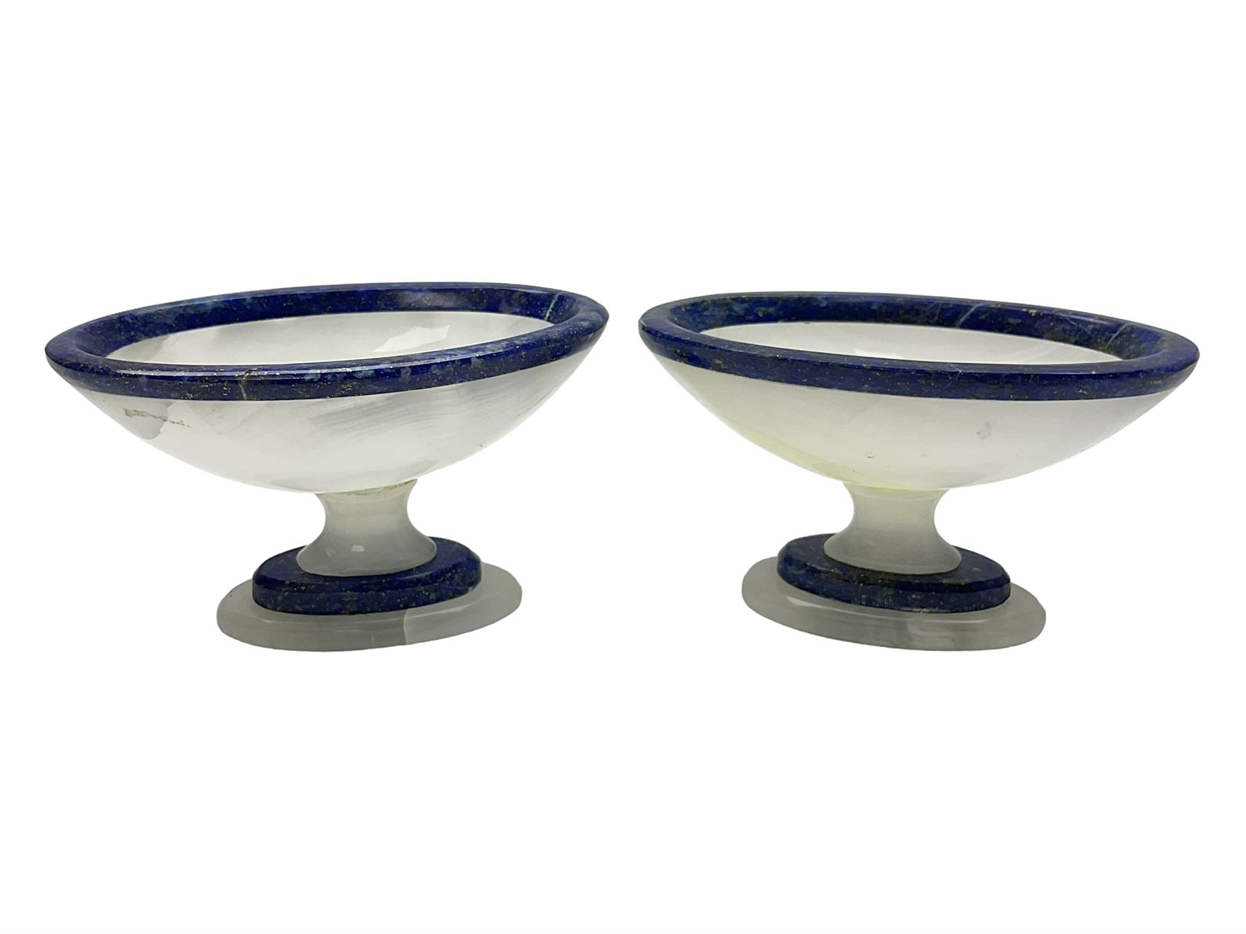 Pair of lapis lazuli and agate open salts, of navette form, upon a stepped oval pedestal foot, H5cm, L8cm