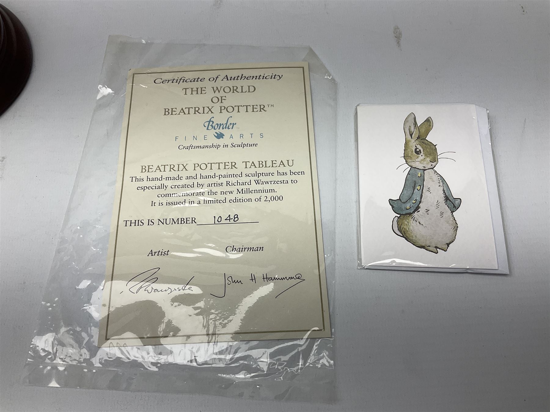 Four Border Fine Arts Beatrix Potter figures, comprising Tableau created to commemorate the Millenium together with a Border Fine Arts Limited Edition no 669814, The Tale of Peter Rabbit Tablet A1306, Four Little Rabbits A2442 and Sailing Home A2443