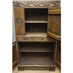  20th century oak chest, Gothic style carvings, two cupboards and centre drawer, W76cm, H138cm, D37cm  