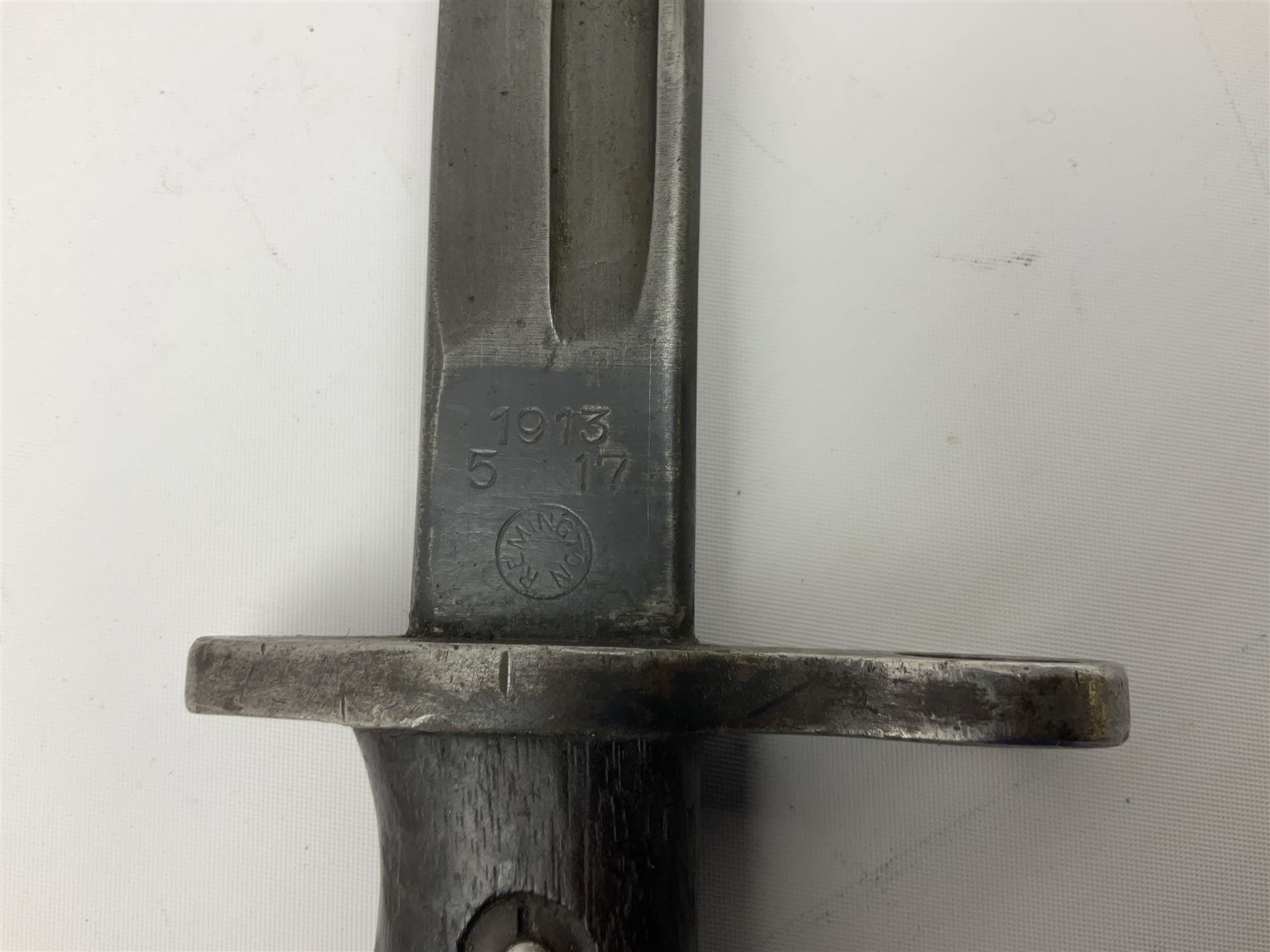 WW1 American Remington P14 rifle bayonet Model 1913, the 43cm fullered steel blade dated 5 17; in metal mounted leather scabbard L57cm overall; and WW1 Canadian Ross Rifle Co.1907 Model Mk.II bayonet, dated 2/17; in leather scabbard with frog (2)