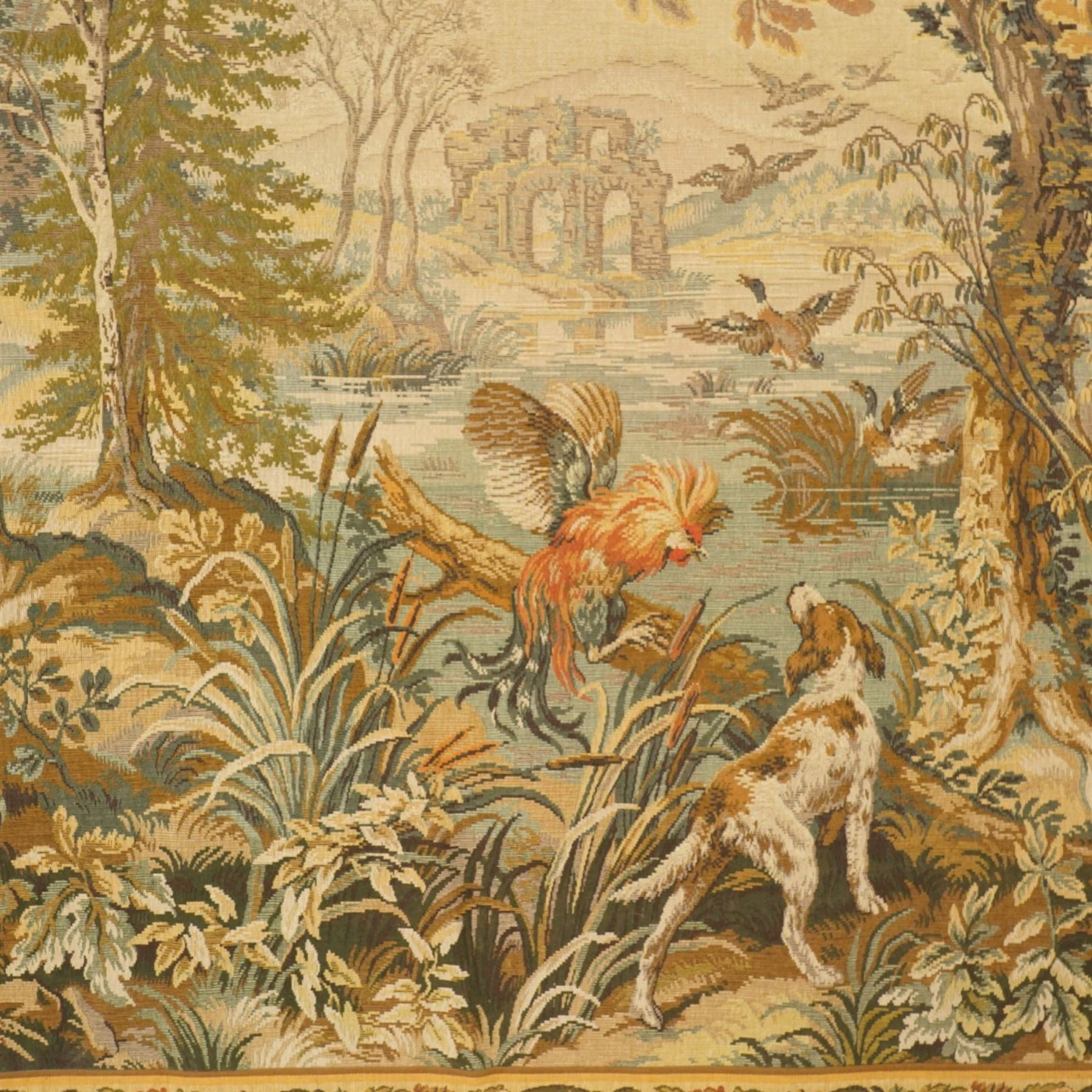 Large French Aubusson style verdure tapestry, of 18th century design but later, depicting a country landscape and ruins with hunting prey to foreground, 153cm x 212cm
