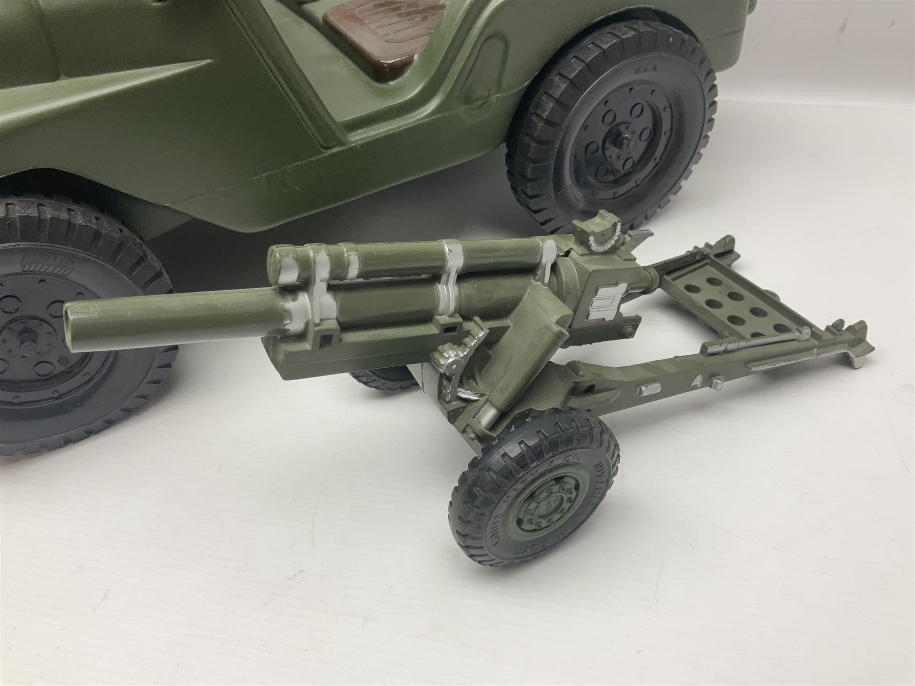 Action Man - five figures marked on the back 'Made in England by Palitoy under licence from Hasbro 1964', one dressed as a German Stormtrooper, one as a Red Devil Pilot and three in army uniform; another similar action figure marked to the right buttock ' G.I. Joe Copyright 1964 by Hasbro Patent Pending Made in Canada' dressed in army uniform; together with an Action Man jeep, field gun, mortar and machine guns and other accessories including helmets and weapons, parachute, diving equipment, skis and snow shoes, boots, uniforms etc; all unboxed