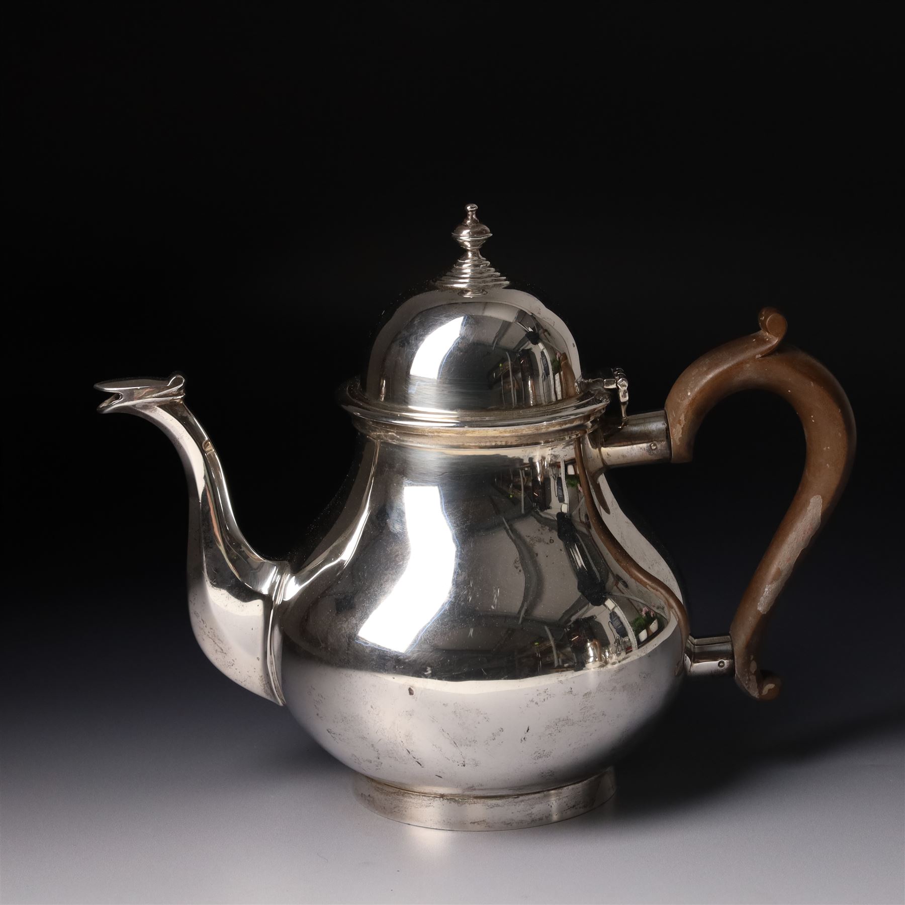 Four piece silver tea and coffee service of baluster form, the tea and coffee pots with domed covers and stained handles London 1916-1918, Maker  C S Harris & Sons Ltd