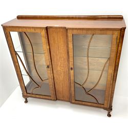 Early 20th century walnut display cabinet, raised back, two glazed single doors revealing fitted interior, cabriole supports 