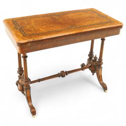 Victorian walnut and inlaid games table, rectangular fold-over top with figured walnut veneers and foliate inlay, swivel and fold over to reveal a green baize lined playing surface, on twin supports united by a stretcher, raised on scroll carved feet with castors (extended 96cm x 92cm)