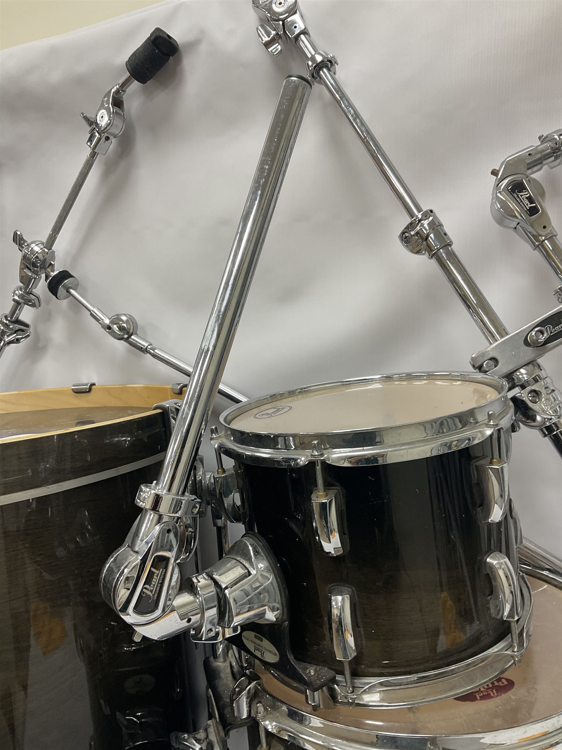 Pearl Vision SST Birch Ply shell four-piece drum kit in black comprising bass drum with foot pedal and three graduated toms; together with Pearl Custom Alloy Sensitone steel snare drum, drum and cymbal stands, microphone stand, stool and various drum sticks 
