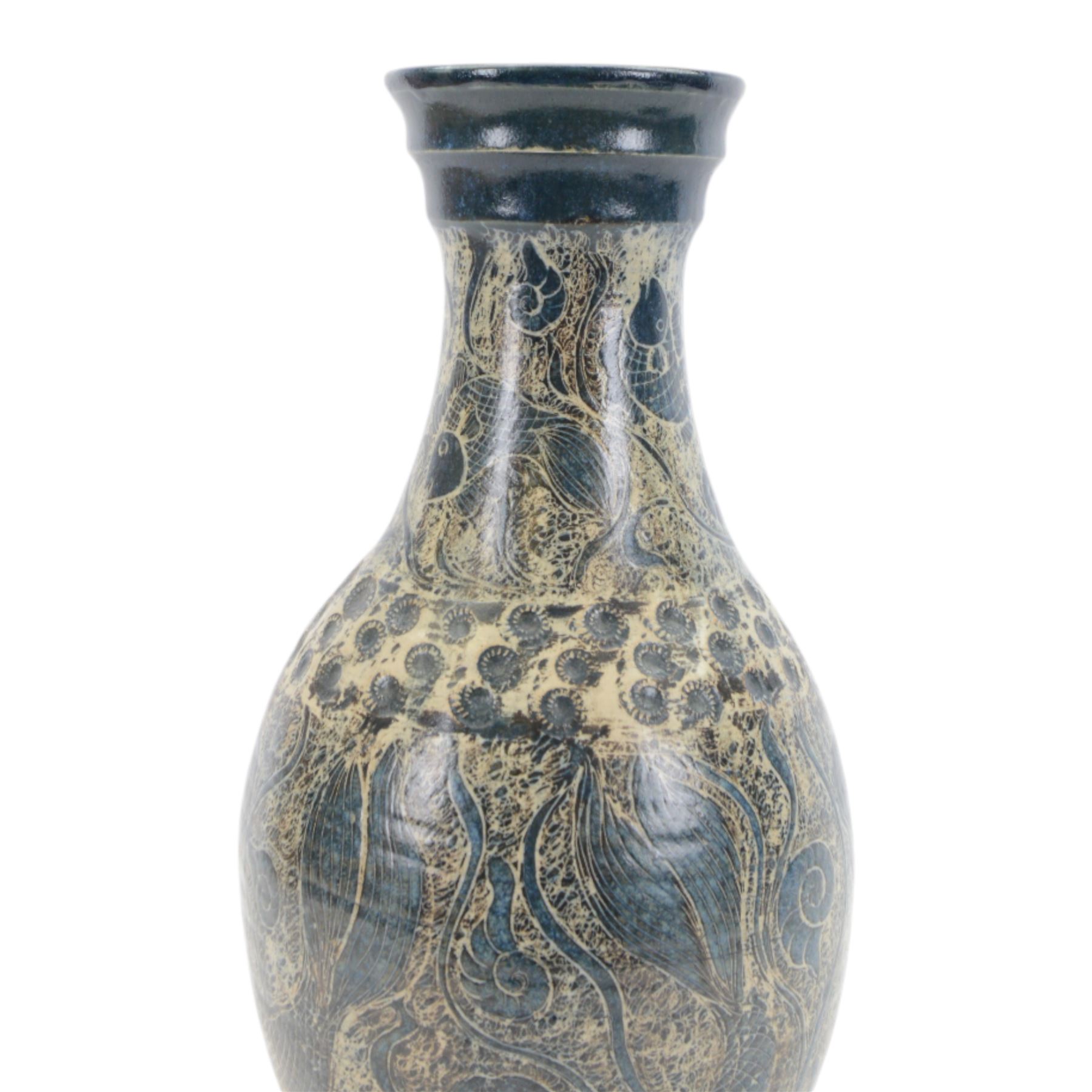 John Egerton (c1945-2024): studio pottery stoneware vase of baluster form, decorated with fish, mermaids and ammonites upon a blue ground, H56cm 