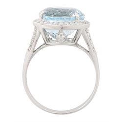 18ct white gold aquamarine and diamond cluster ring, single oval cut aquamarine of approx 8.20 carat, surrounded by milgrain set round brilliant cut diamonds, with diamond gallery and split diamond set shoulders, stamped 750, total diamond weight approx 0.30 carat