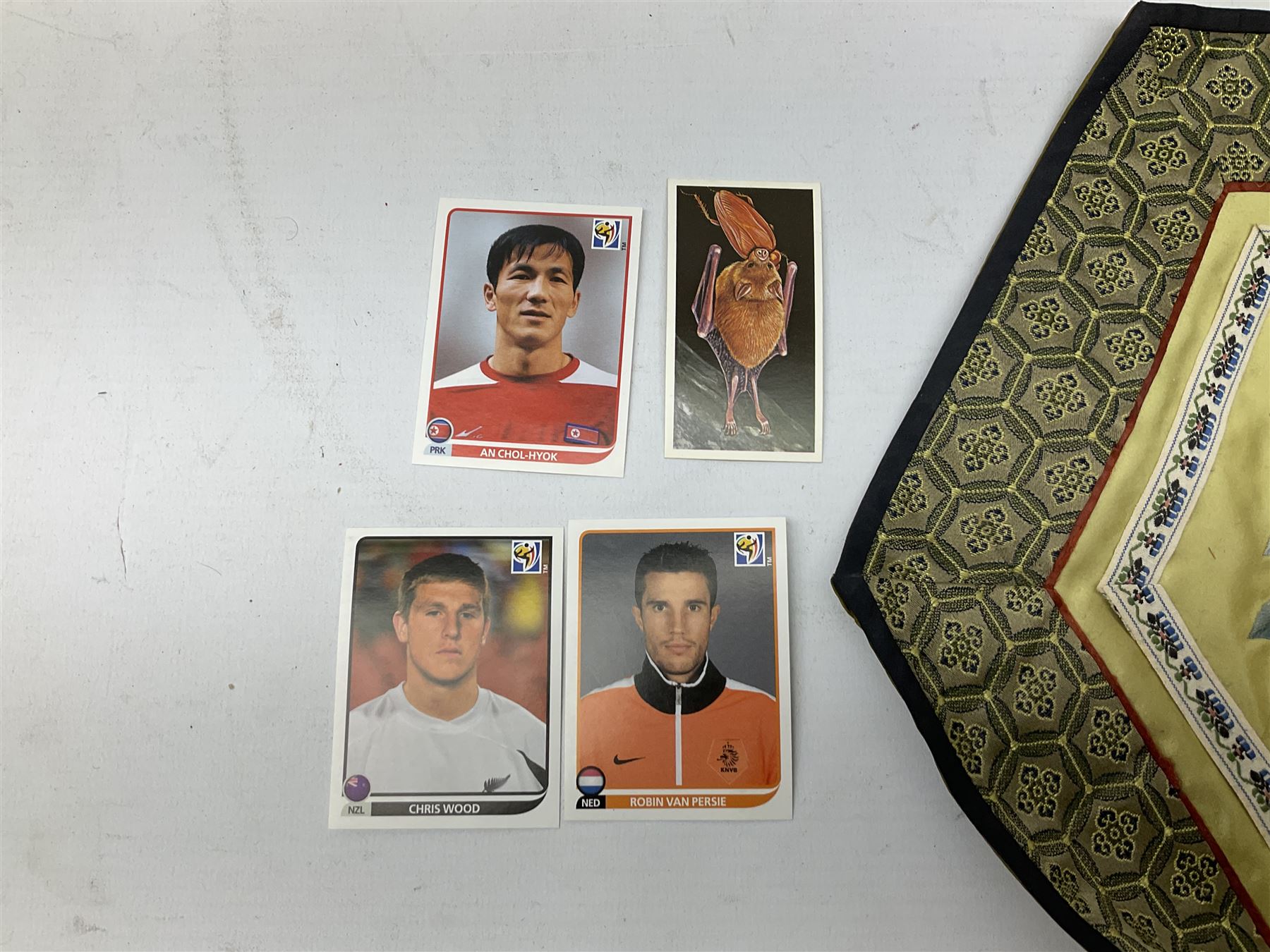 Six Chinese silks on fabric panels embroidered with birds on blossoming branches, along with three other Chinese painted silks 