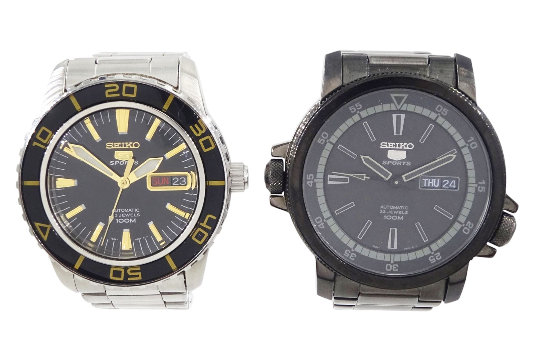 Seiko 5 Sports gentleman's stainless steel automatic wristwatch, Ref. 7S36-04N0, black dial with gilt baton hour markers and one other Seiko 5 Sports, Ref. 7S36-04X0, with grey dial and baton hour markers, both with day-date apertures and exhibition back cases, one boxed