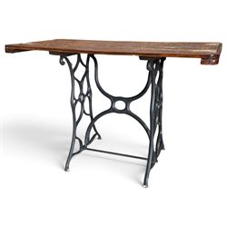 Antique rectangular slatted hardwood garden table, raised on pierced black painted cast ir...