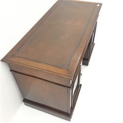  Early 20th century mahogany twin pedestal desk, leather inset top, two short and one long drawer, two cupboards, plinth base, W122cm, H74cm, D57cm  