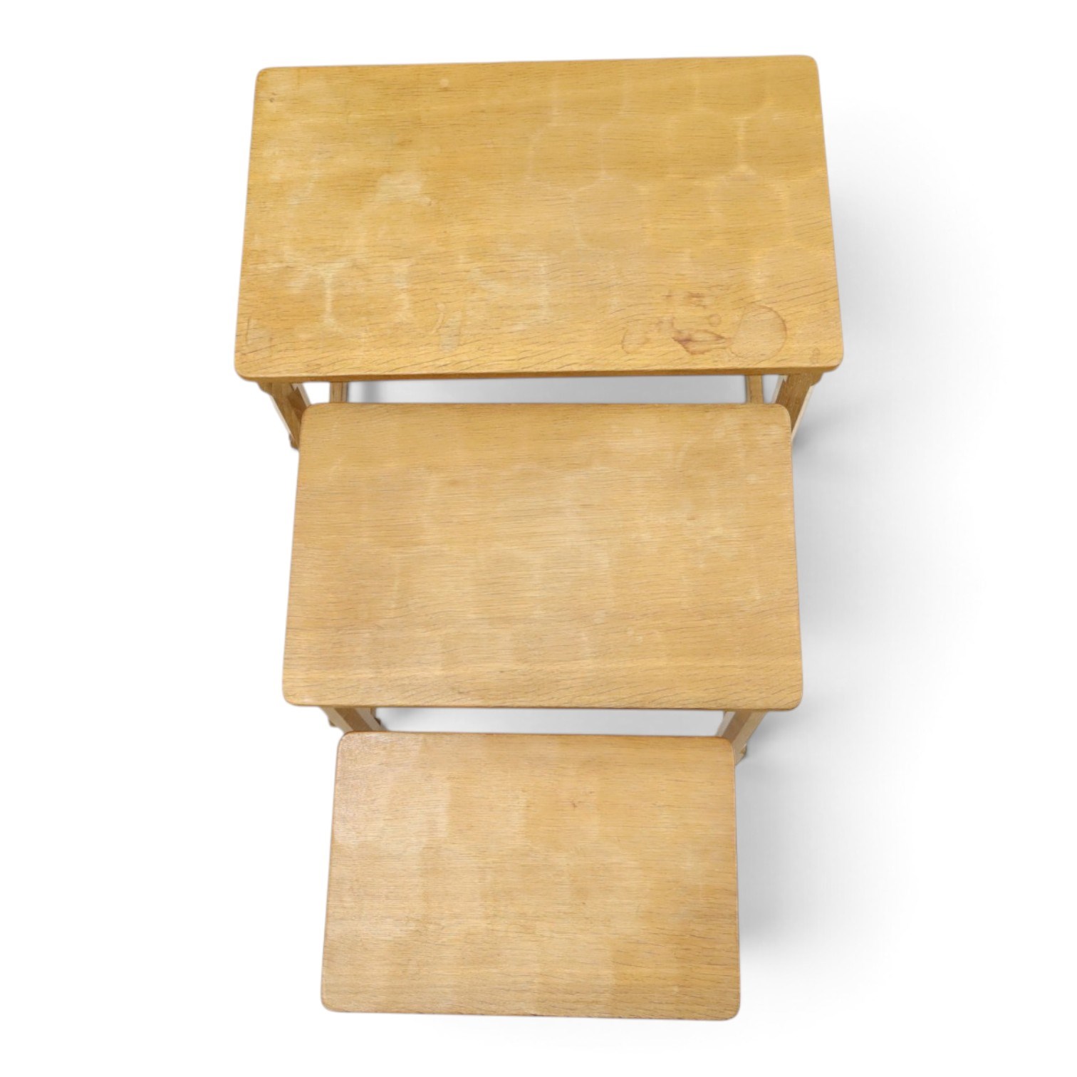 Mouseman - nest of three oak occasional tables, rectangular adzed top, on octagonal supports united by plain stretchers, each carved with mouse signature, by the workshop of Robert Thompson of Kilburn