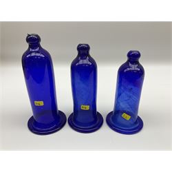 Set of three graduating hand blown blue glass smoke bells, tallest example H18cm 