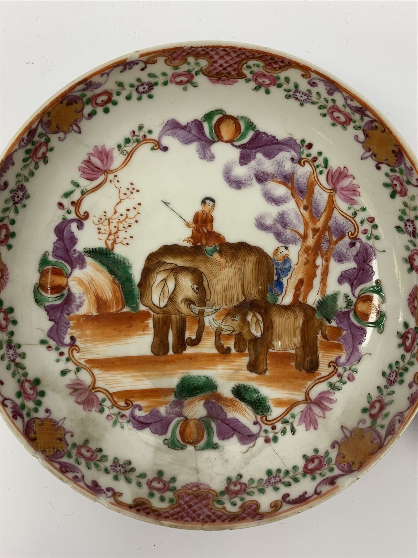 18th Century Chinese export tea bowl and saucer, decorated in the Famille Rose pallet with figures and elephants, tea bowl D8.5cm, saucer D13.5cm