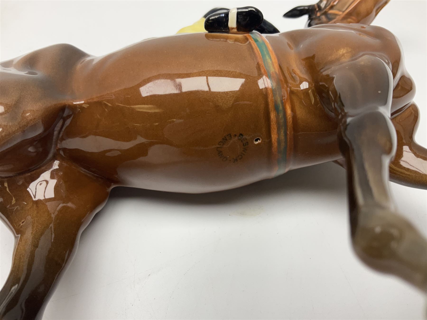 Beswick jockey on walking horse no 1037, in black white and yellow jockey colours, with printed mark beneath, H22cm