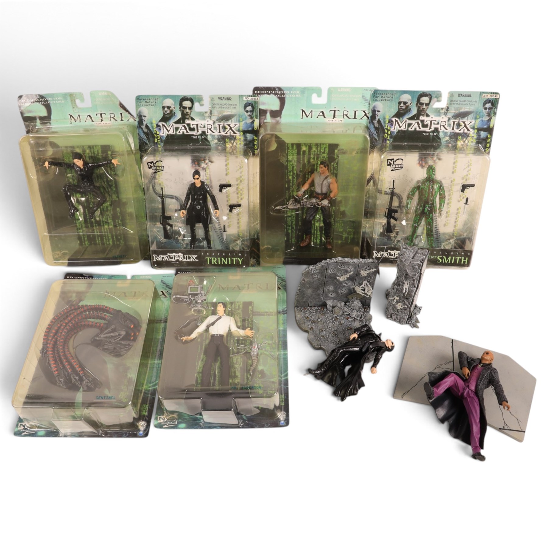 Six N Toys The Matrix action figures, comprising Tank, Agent Smith, Mr Anderson, Sentinel, and two Trinity versions, together with two unboxed The Matrix figures