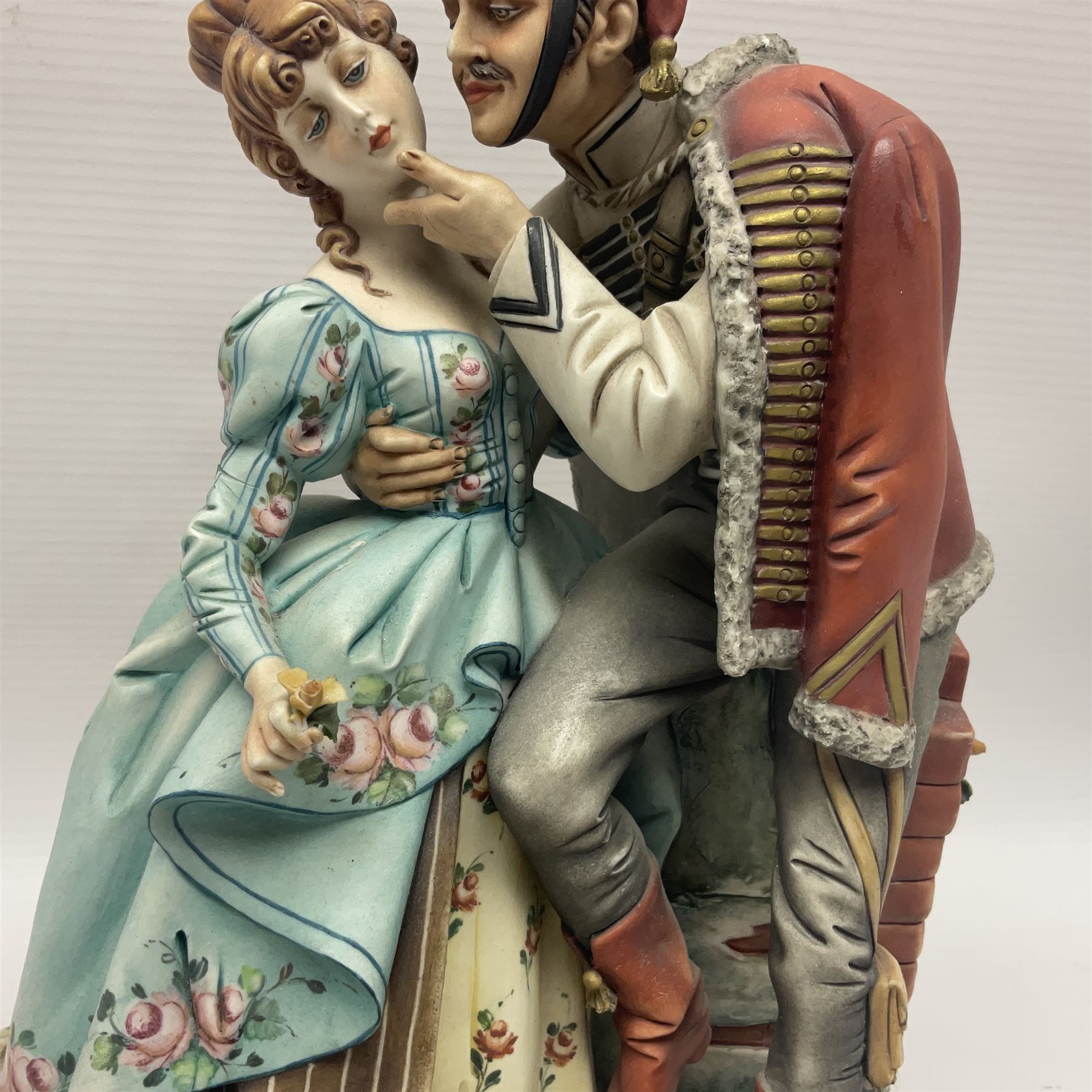 Two Royal Doulton figures, Buttercup HN2309 and Ascot HN2356, together with Capodimonte figure Hussar and His Lady 
