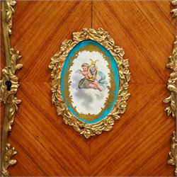 Late 19th century French Louis XV style kingwood and ormolu mounted bonheur du jour, the upper section with a pierced three-quarter gallery over a pair of cupboard doors inset with Sèvres-style porcelain portrait plaques, enclosing a shelved interior over two short drawers, the serpentine top and apron richly mounted with gilt-bronze foliate and scroll motifs, single frieze drawer below on cabriole supports with acanthus cast sabots