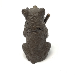 A bronze match holder or vesta, modelled in the form of a bear holding a stick and smoking a cigar, with cold painted detail, impressed beneath Bergm, H7.5cm. 