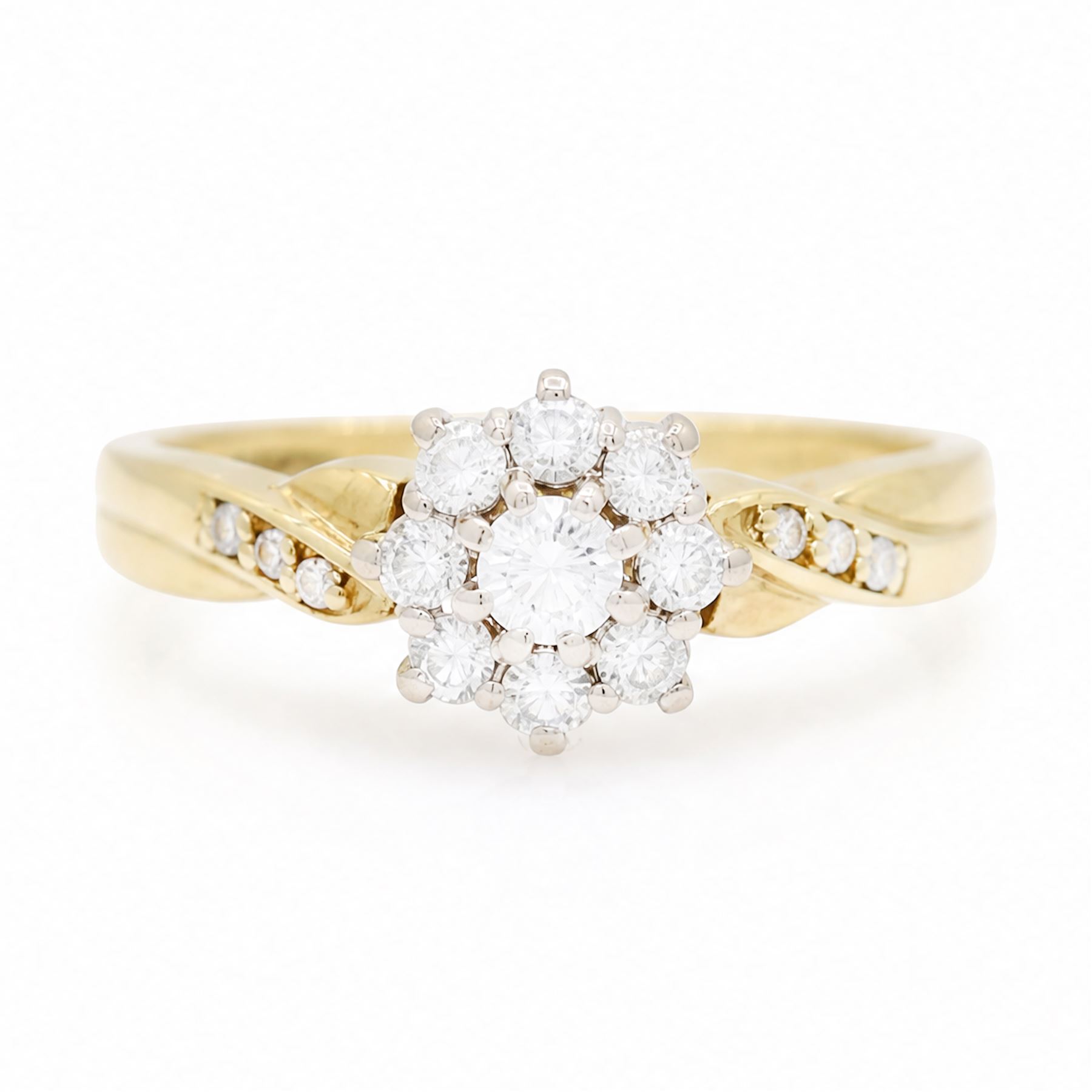 18ct gold diamond flower head cluster ring, set with nine round brilliant cut diamonds, with diamond set shoulders, London 1991, total diamond weight approx 0.40 carat